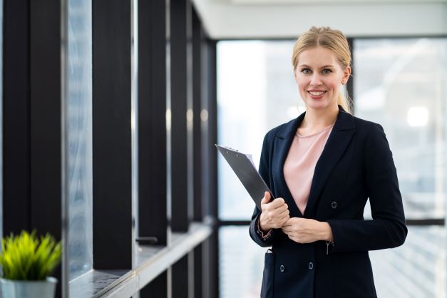 young businesswoman holding clipboard