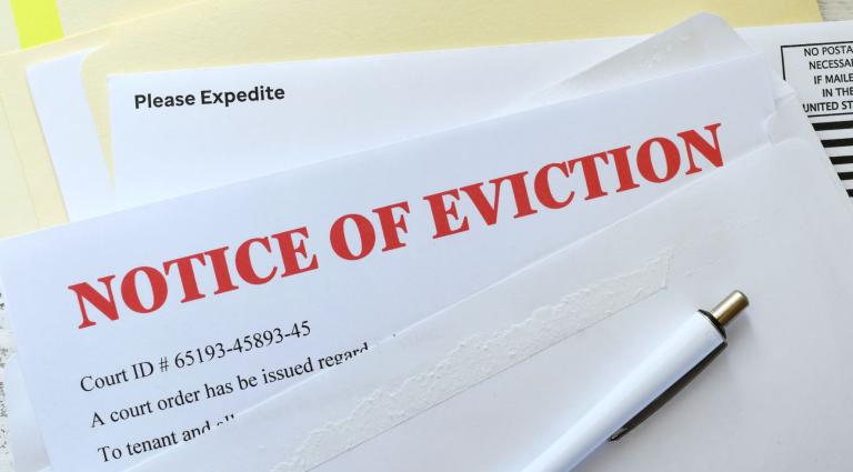 notice of eviction in red in an envelope