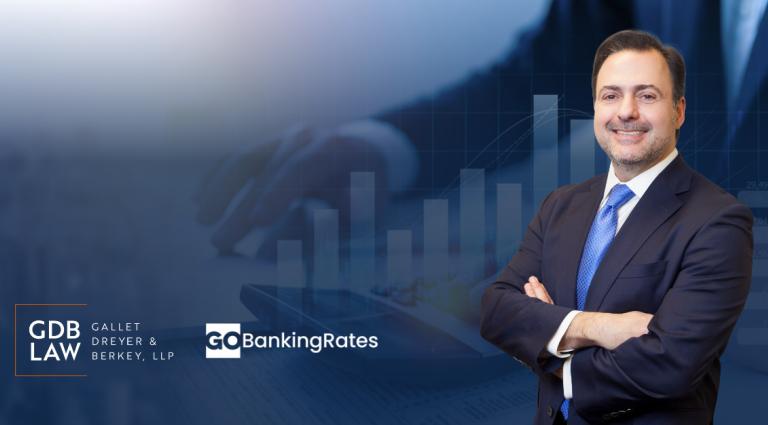 Asher Rubinstein in front of Trump Tax Cuts